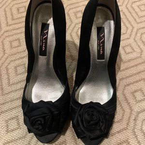 Black satin high heel pumps